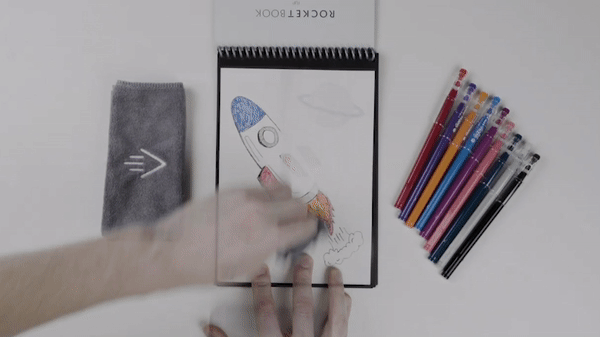 person using Rocketbook microfiber cloth to erase Rocketbook