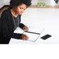 woman writing in the Core notebook