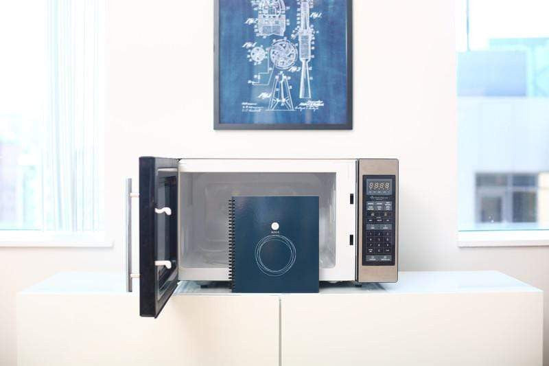 Rocketbook Wave next to a microwave