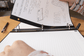 individual taking filler paper out of a binder